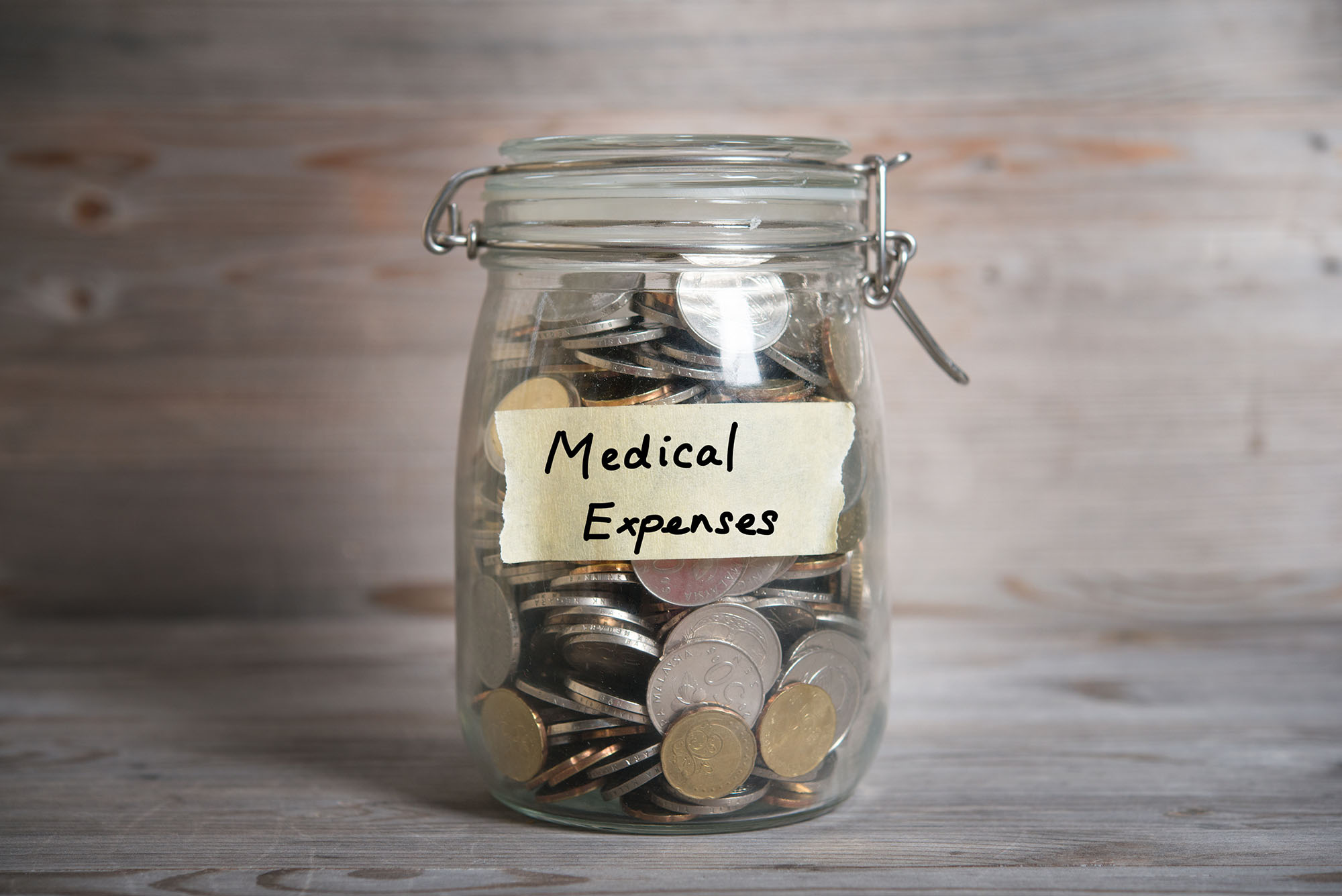 jar of coins to pay for medical expenses